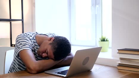 Sleeping-Black-Man-at-Work,-Head-on-Desk