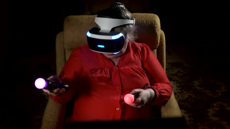 Elderly-woman-in-VR-headset-uses-move-motion-controller-for-video-game-console