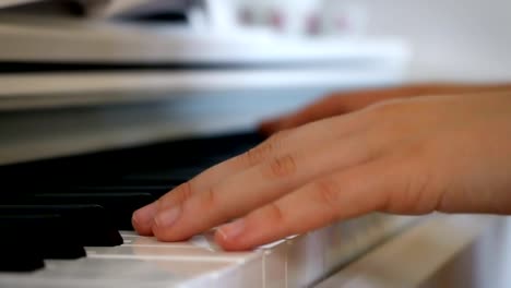 Playing-the-piano,-very-close-zoom