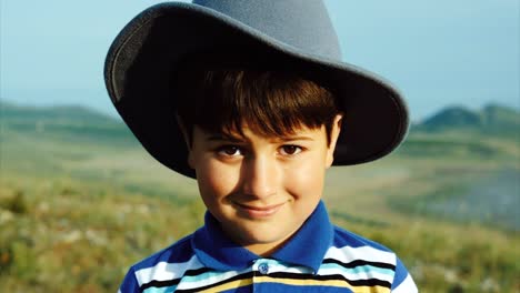 Portrait-of-a-smiling-boy-in-a-felt-hat