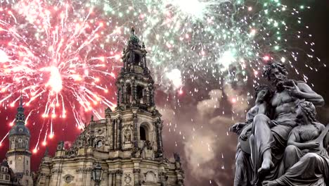 Sculpture-on-the-Bruhl-Terrace-and--Hofkirche-or-Cathedral-of-Holy-Trinity-and-holiday-fireworks---baroque-church-in-Dresden,-Sachsen,-Germany