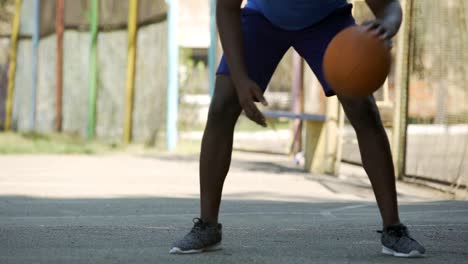 Afro-American-person-playing-basketball,-training-before-game,-active-lifestyle