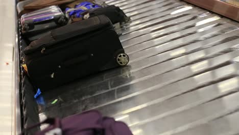 Baggage-conveyor-belt-in--Airport-carrying-the-passenger-luggage.-Thailand