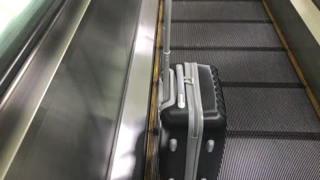 Travel-bag-on-travelator-or-slide-way-in-airplane