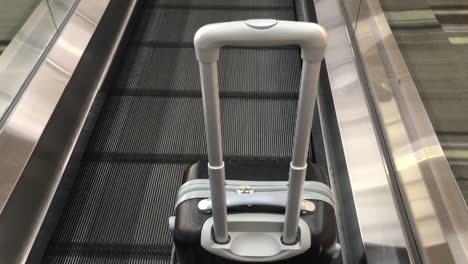 Travel-bag-on-travelator-or-slide-way-in-airplane