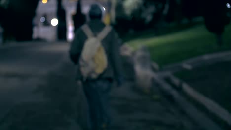 lonely-Homeless-walking-in-the-city-park-at-night--Rome,-Italy