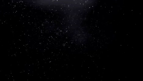 Realistic-beautiful-snowflakes-falling-and-spinning-in-black-space.-Looped-video.