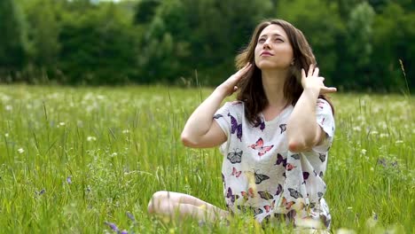 Female-on-grass-enjoying-life-looking-up-to-sky-in-summer,-joyful-lady-outdoors