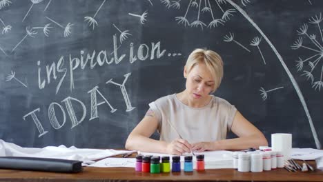 Female-Artist-Painting-in-Studio