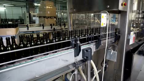 Bottling-and-sealing-conveyor-line-at-winery-factory