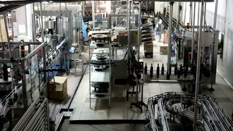 Bottling-and-sealing-conveyor-line-at-winery-factory