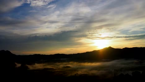 time-lapse-of-sunrise-in-dawn-with-mountain-and-foggy-landscape