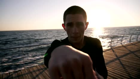 Man-Exercising-on-Seaside-Promenade