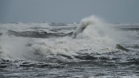 High-wave-breaking-on-the-rocks-of-the-coastline.-Extremely-Big-Wave-crushing-coast-,-Large-Ocean-Beautiful-Wave.-Super-Slow-Motion.