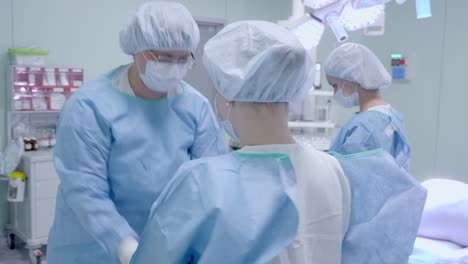 Surgeons-in-the-operating-room-are-preparing-for-surgery.-Wear-clothes-and-masks