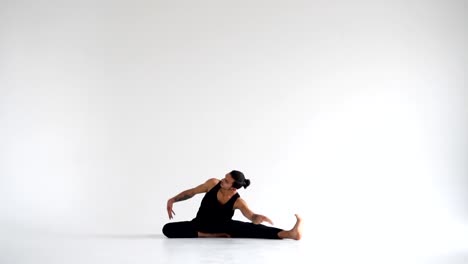 Man-practicing-intense-yoga-asana