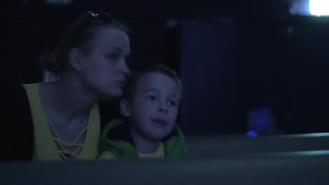 Mom-and-kid-spending-leisure-at-the-cinema