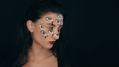 Maquillaje-de-Arte-Halloween,-la-mujer-tiene-muchos-ojos-en-una-cara