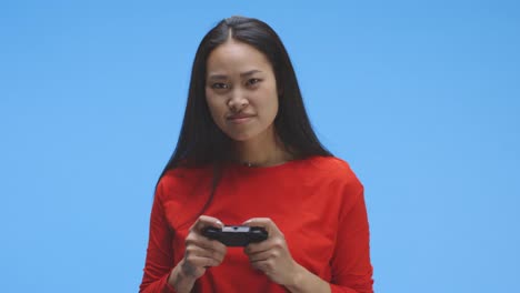 Young-woman-playing-video-game-with-controller