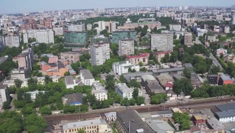 Aerial-view-of-one-of-the-districts-of-Moscow.-Summer-weather.-Urban-cityscape-from-quadrocopter.-Development-infrastructure-city-for-big-population,-urban-transportation-system.