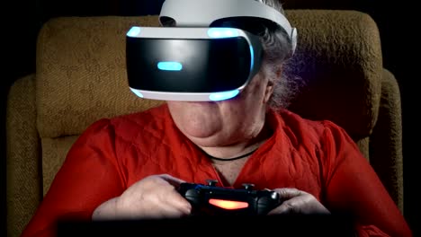 70-year-old-woman-playing-video-game-uses-VR-headset-and-gaming-controller