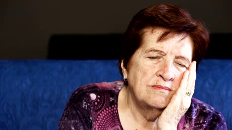 sad-thoughtful-old-woman.-Portrait-of-pensive-elderly-woman