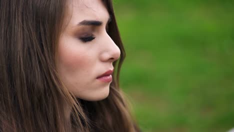 Profile-of-beautiful-and-sad-woman-thoughtful