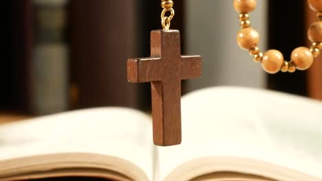 Wooden-Rosary-Hanging-in-Front-of-Library.-Panning.