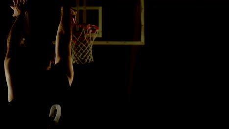 Male-basketball-player-throwing-basketball-in-the-basketball-hoop-4k