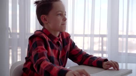 Boy-using-computer-at-home.-Emotions