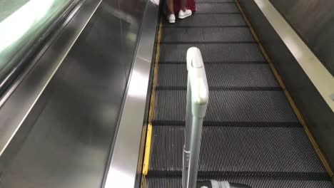 Travel-bag-on-travelator-or-slide-way-in-airplane