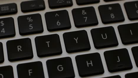 Rotating-White-Laptop-Keyboard-with-Black-Keys