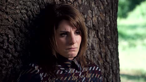 sad-and--lonely-Woman-crying-Laying-Under-The-Tree--Outdoor