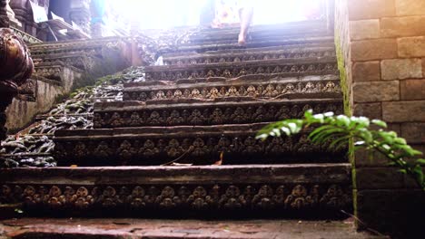 Young-Tourist-woman-walking-up-through-the-sun-in-a-temple.-slow-motion.-3840x2160