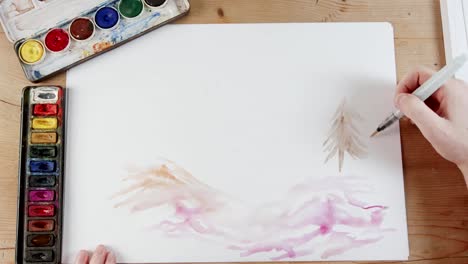 Timelapse-of-artist-painting-landscape-with-watercolors