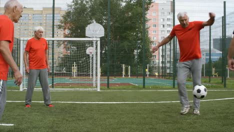 Group-of-Seniors-Training-with-Football-Outdoors