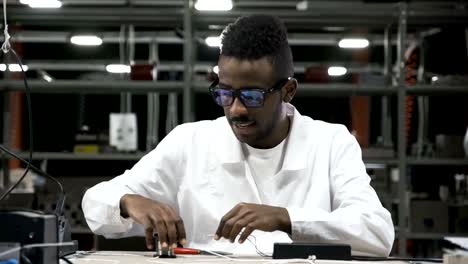 Engineer-soldering-wires-and-circuits-at-work