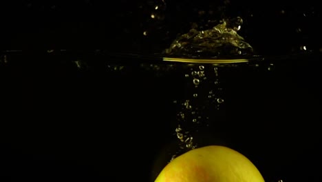 Falling-of-apples-in-water.-Slow-motion.