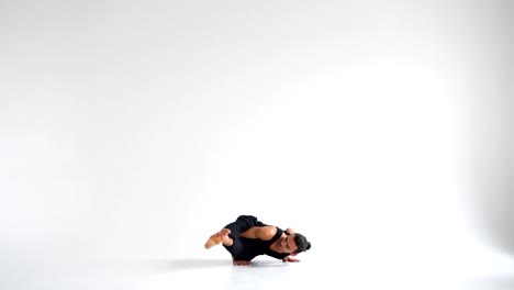 Man-practicing-intense-yoga-asana