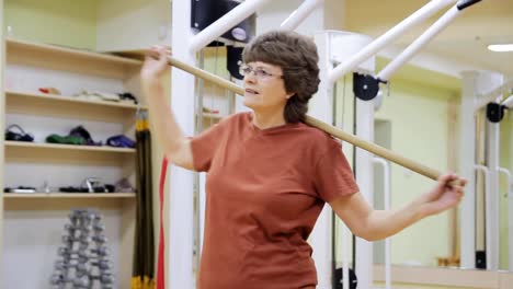 Senior-woman-doing-exercises-in-fitness-room.