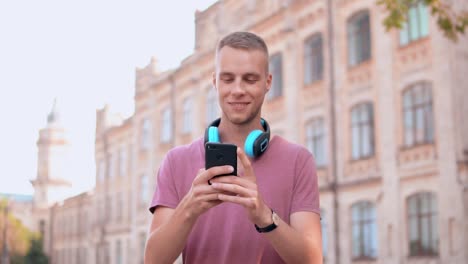 young-student-messaging-on-mobile-outdoors