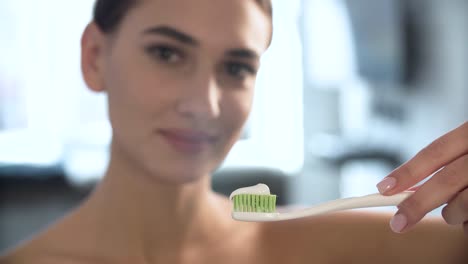 Teeth-Hygiene.-Woman-Applying-Toothpaste-On-Toothbrush-Closeup