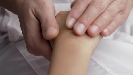 Doctor-stroking-patients-hand.