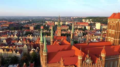 Gdansk-old-city-in-the-rays-of-the-rising-sun,-aerial-view-of-the-old-city-streets