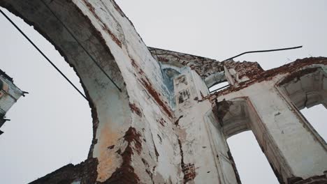 Inside-abandoned-orthodxal-temple,-red-bricks-walls,-cold-cloudy-day