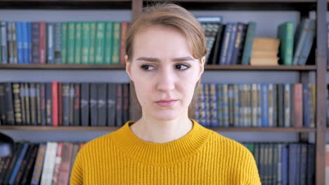 Portrait-of-Sad-Young-Woman-Looking-at-Camera