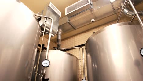 Close-up-tanks-in-brewery-warehouse.