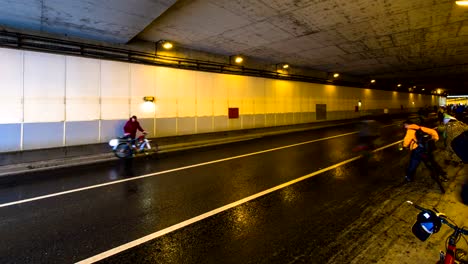 parade-of-bicyclists,-bike-riders--despite-the-bad-weather,-time-lapse