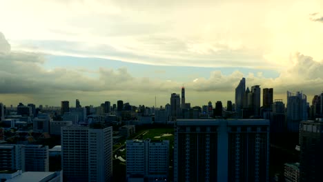 Storm-clouds-with-rain-passing-over-sky-of-Bangkok-cityscape.-4K-Timelapse