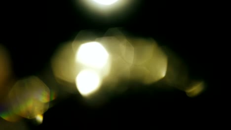 Futuristic-golden-natural-light-pulses-and-glows.-Beautiful-yellow-bokeh-flickers-and-shimmers-in-the-dark